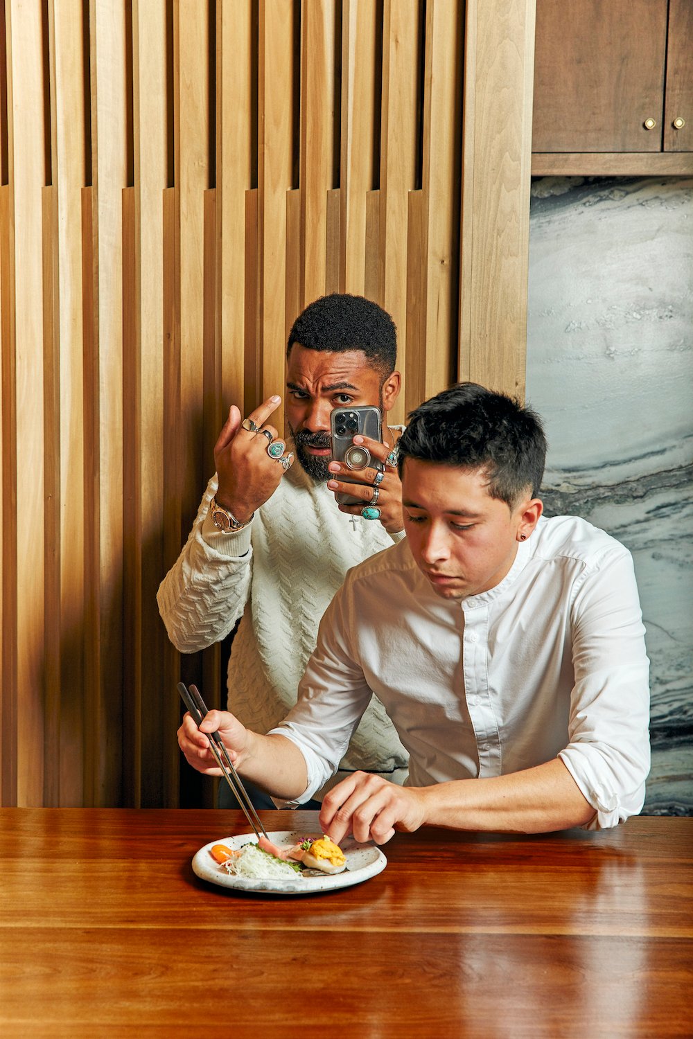 Tik Tok celebrity and influencer Jordan Howlett at San Diego restaurant Kinme Omakase recording an Instagram reel