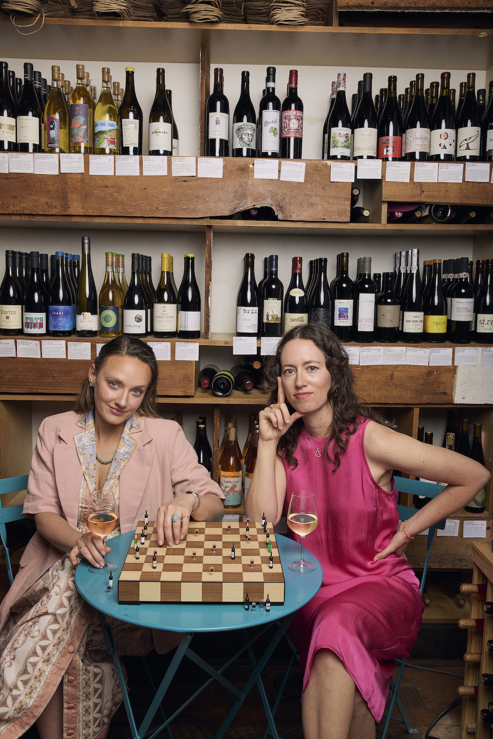 Chelsea Coleman and Coco Randolph, the founders of San Diego restaurants and bars Mabel's Gone Fishing, The Rose, and Rosetta Bodega, in a wine bar playing chess
