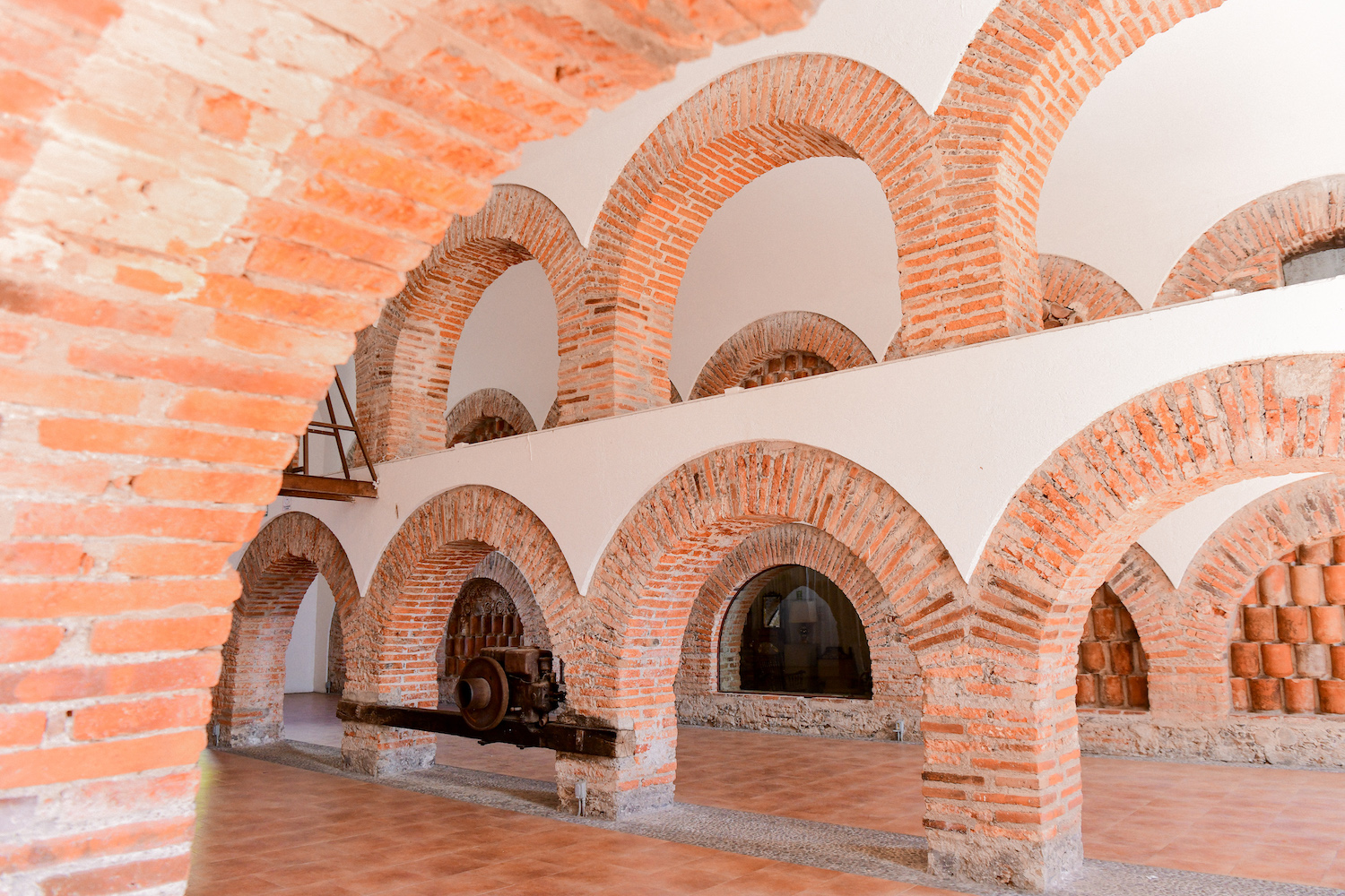 Interior of the Alejandro Rangel Hidalgo University Museum in Comala, Mexico featuring brick arched architecture