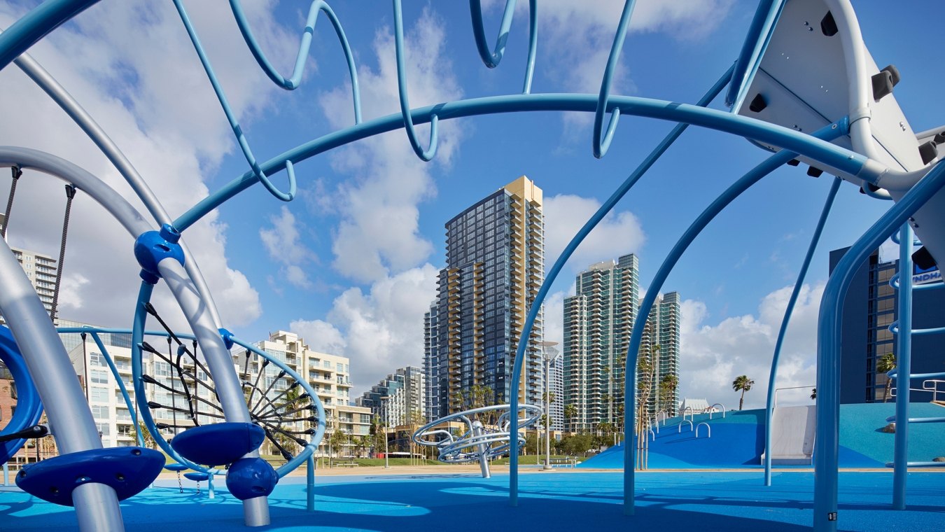 San Diego's Waterfront Park in downtown featuring a playground for kids and small pools with fountains 