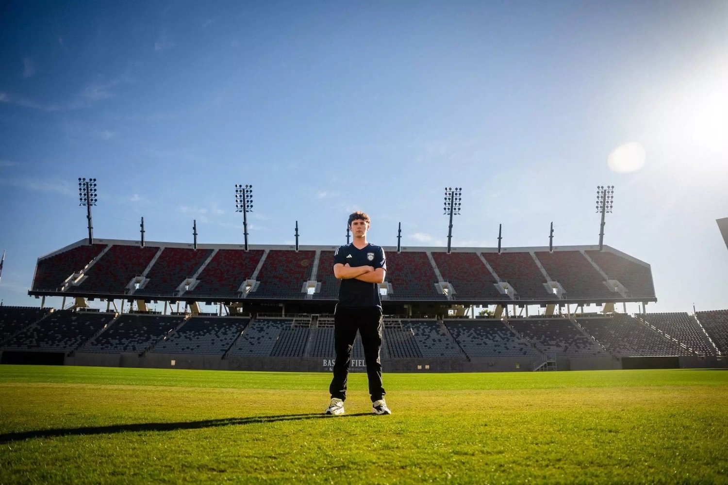 San Diego Futbol Club soccer player standing on Snapdragon Stadium ahead of their inaugural 2025 season in the MLS