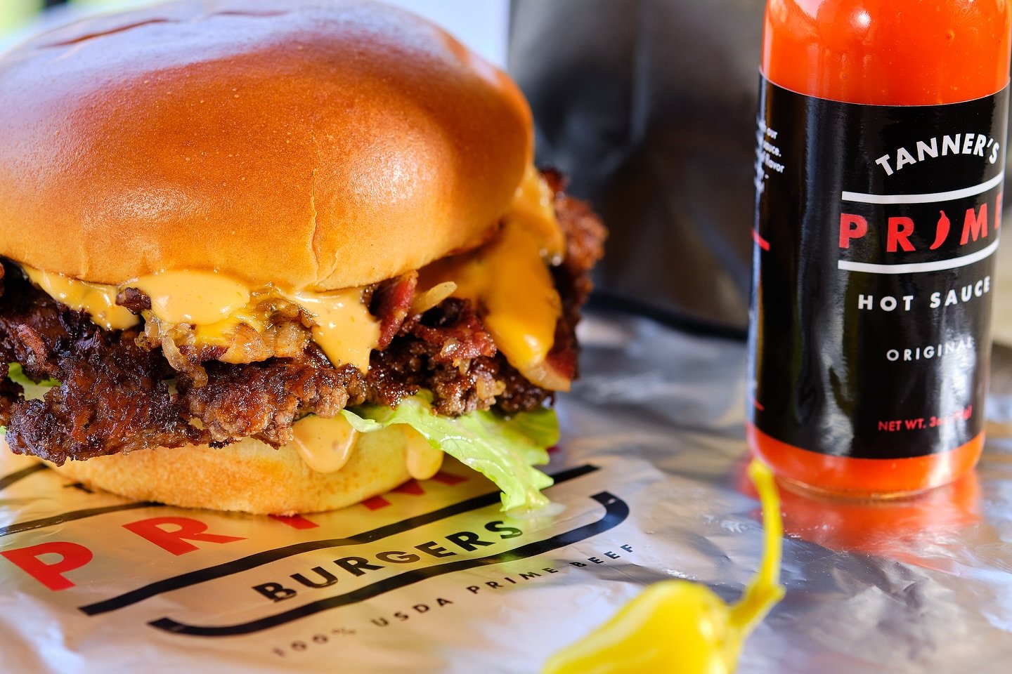 Tanner's Prime Burger opening their first brick-and-mortar location this week in Oceanside, San Diego featuring a bruger and Tanner's Prime hot sauce