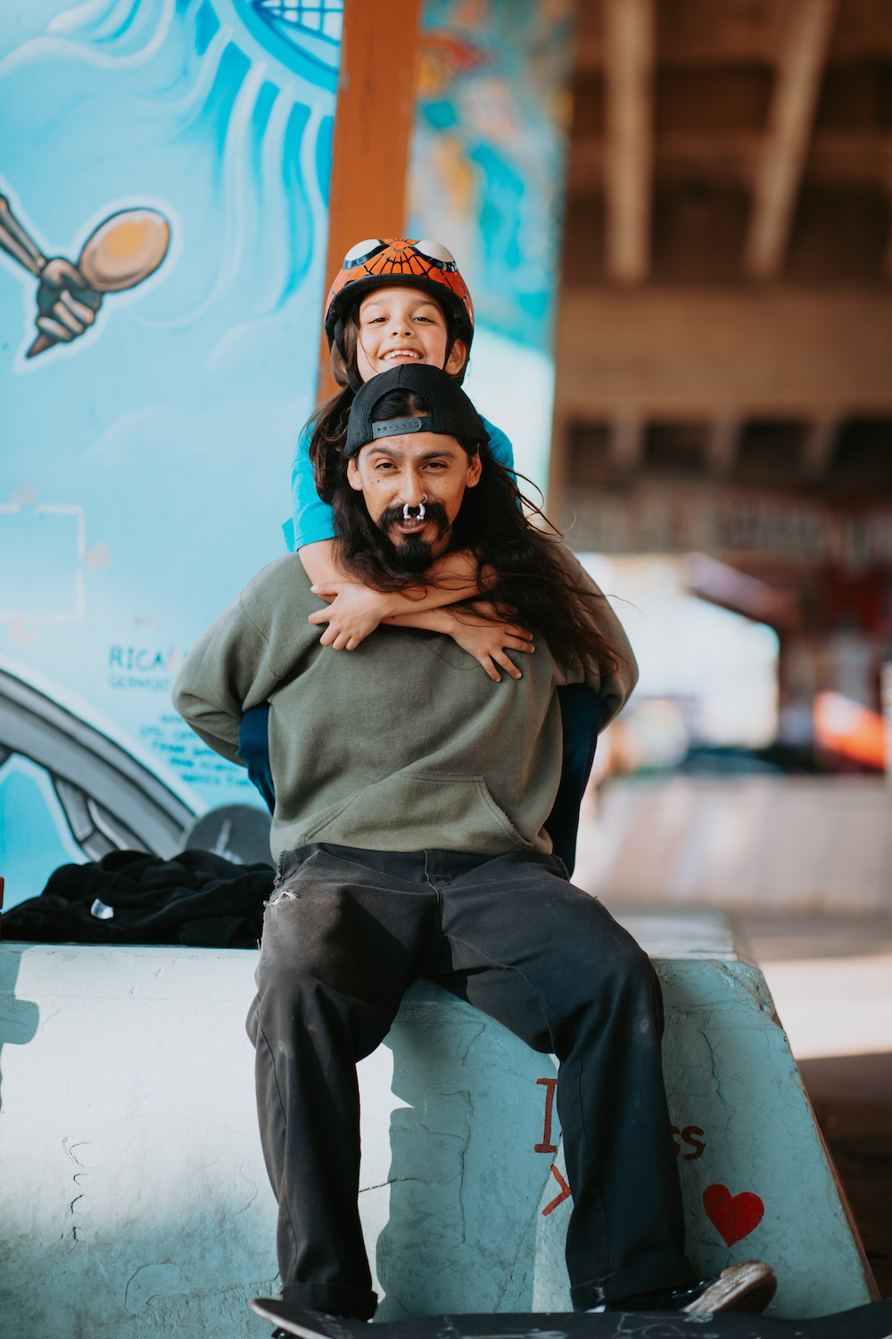 San Diego skater fashion featuring father and daughter skateboarders at Chicano Park Skatepark, Barrio Logan