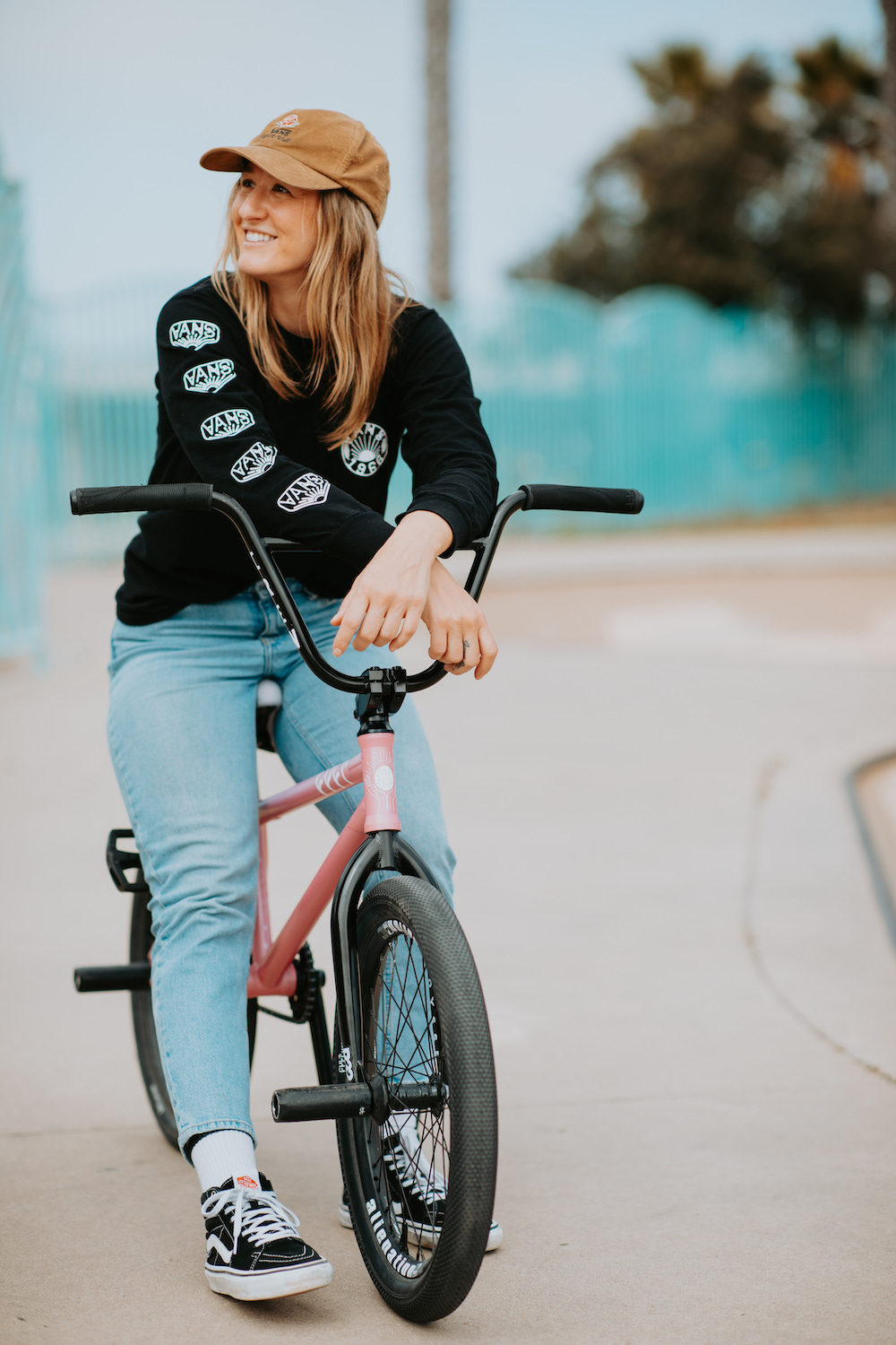 San Diego skater fashion featuring pro BMX cyclist Angie Marino on her bike in Robb Field Skate Park, Ocean Beach