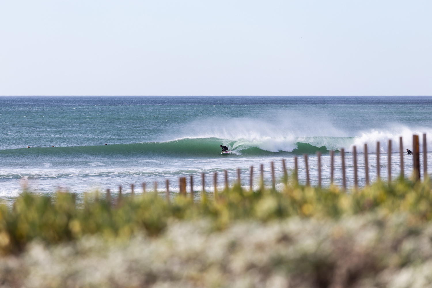 The best surf spots in San Diego featuring Cardiff beach with a surfer in the barrel