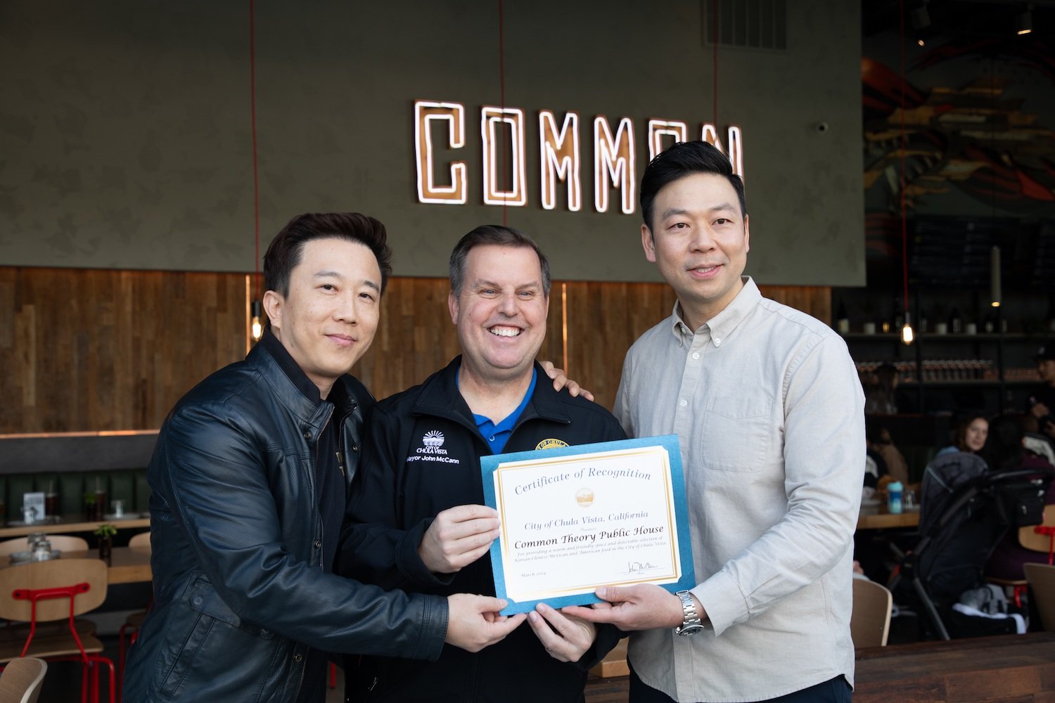 Common Theory founders Joon Lee and Cris Liang, who are opening Sura Korean BBQ, with Chula Vista mayor John McCann 