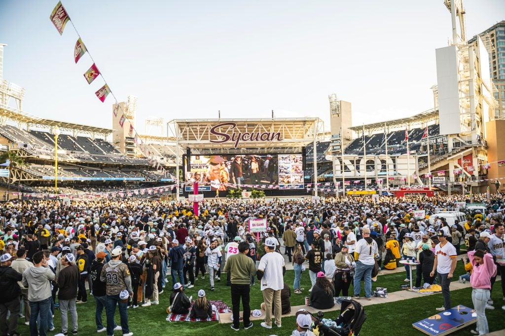 Fans enjoy the Party in the Park at Gallagher Square before the game at Petco Park in San Diego, California.
