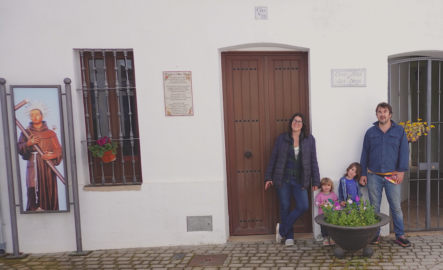 San Diego Magazine writer María Jose Duran with her family at the exterior of Saint Diego's home in San Nicolás del Puerto in Servilla, Spain