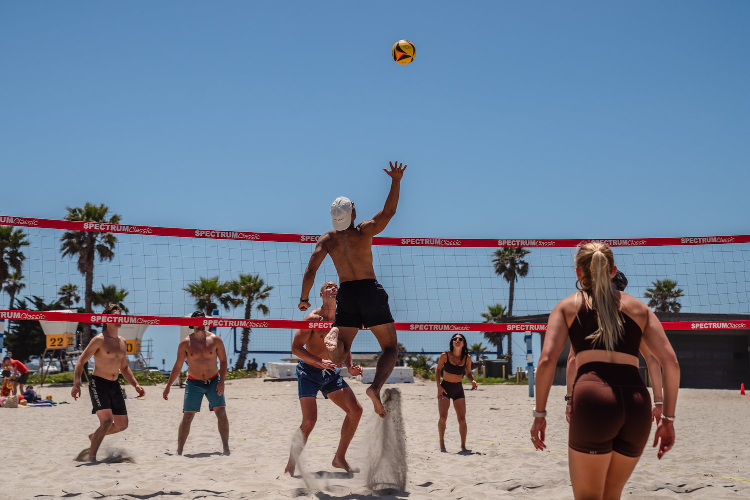 San Diego locals playing volleyball at the Mission Beach volleyball courts