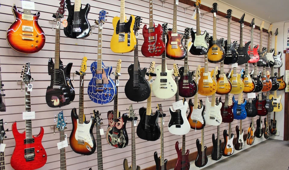 Collection of guitars at San Diego music shop Dusty's Guitars