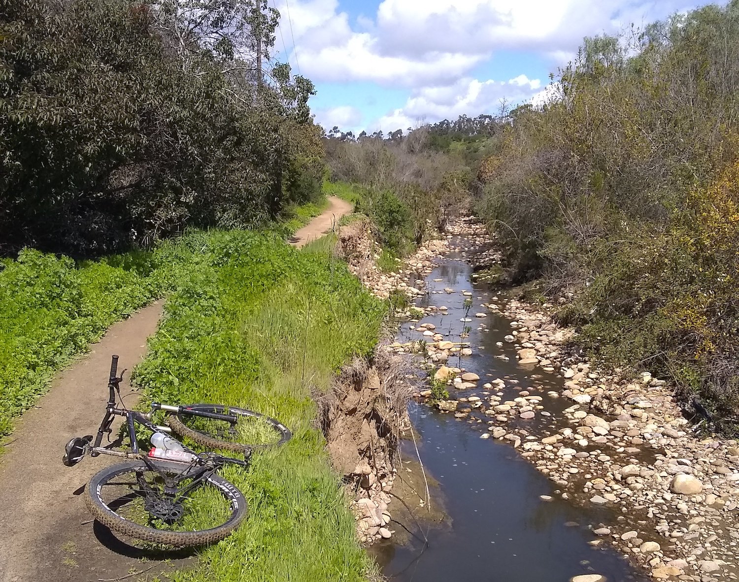San Diego bike trail called Florida Canyon Trail found close to Balboa Park featuring a mountain bike and a stream