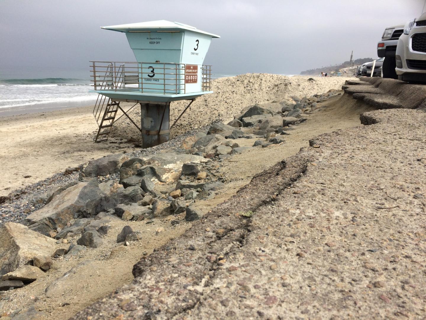 San Diego beach erosion featuring a parking lot close to the water's edge 