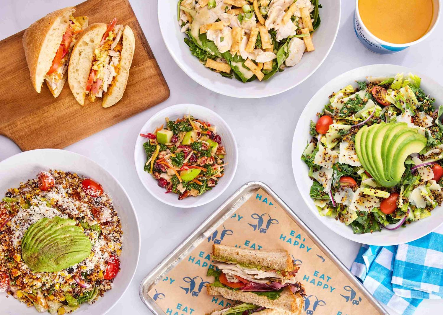 A table full of sadwiches, salads, and other food from food-chain Mendocino Farms which is opening a new location in Scripps Ranch