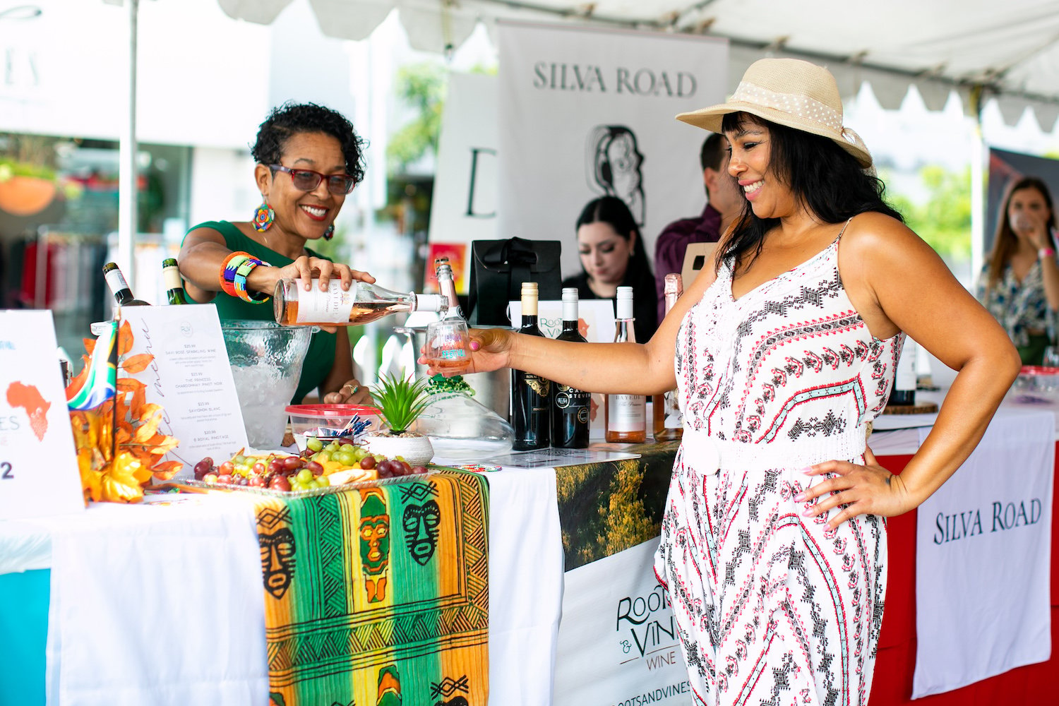 The 16th annual La Jolla Art & Wine Festival event happening on September 28, 2024 featuring a wine vendor pouring a glass