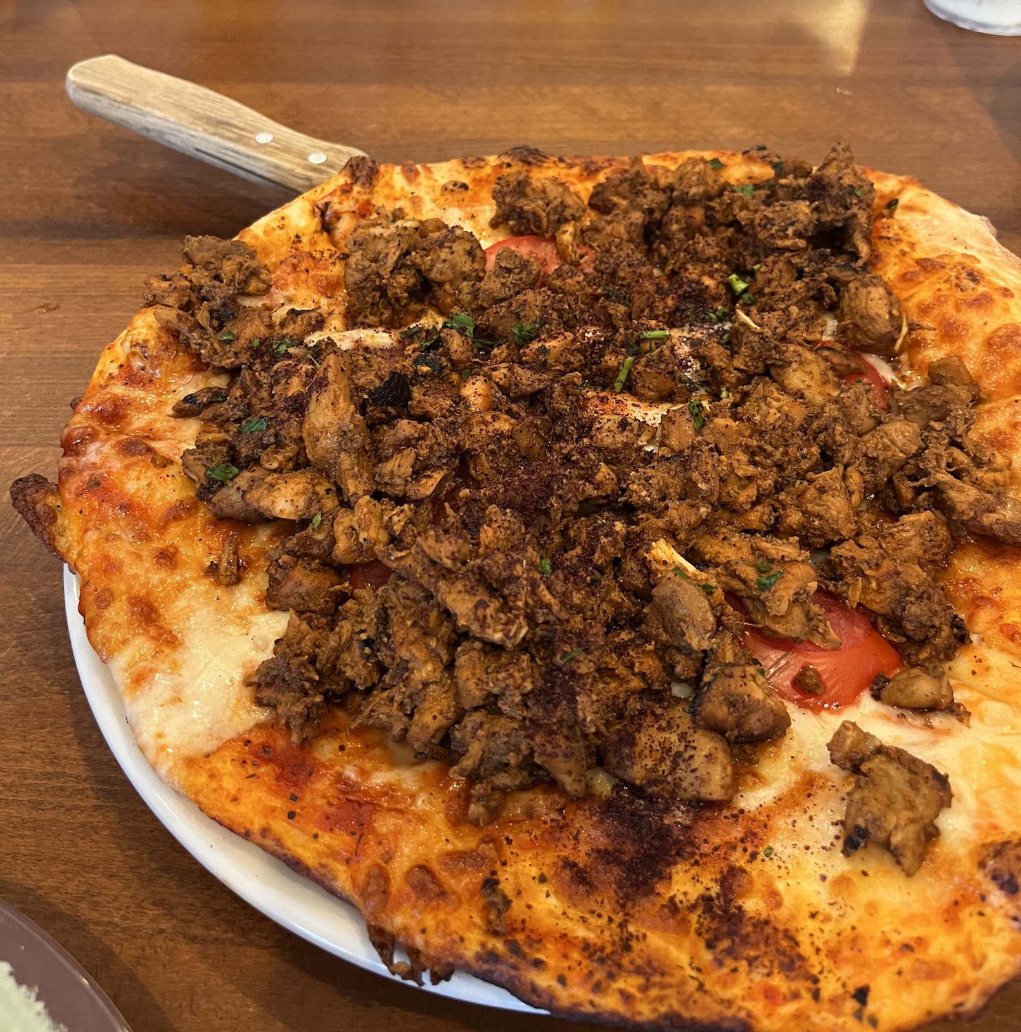 The best food and drinks in San Diego to try this month featuring Chicken Shawerma Pizza from Alladin Cafe in Clairemont Mesa