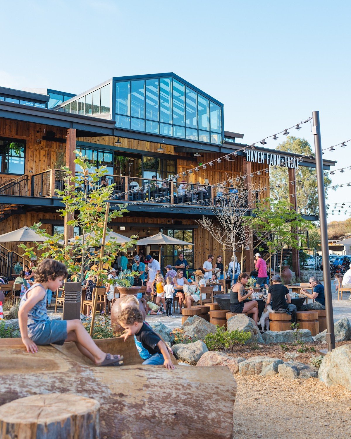 Exterior of new Encinitas farm-to-table restaurant Haven Farm+Table at Fox Point Farms featuring outdoor dining