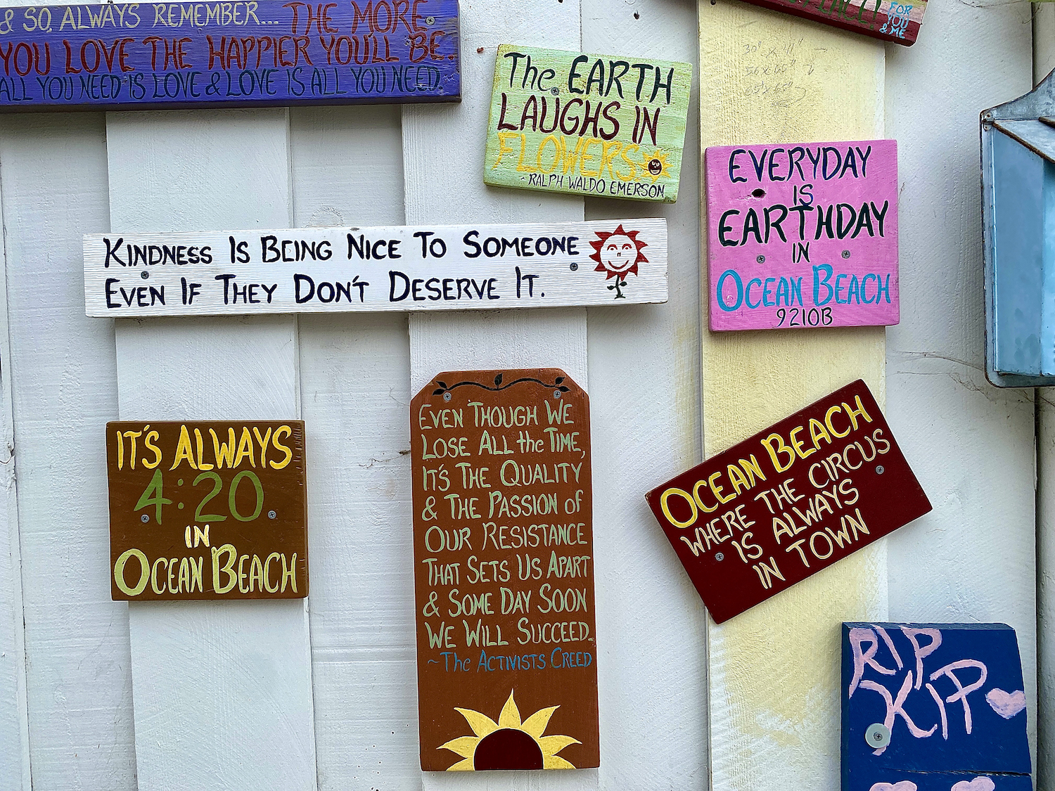 Colorful painted signs outside of an Ocean Beach residents house 