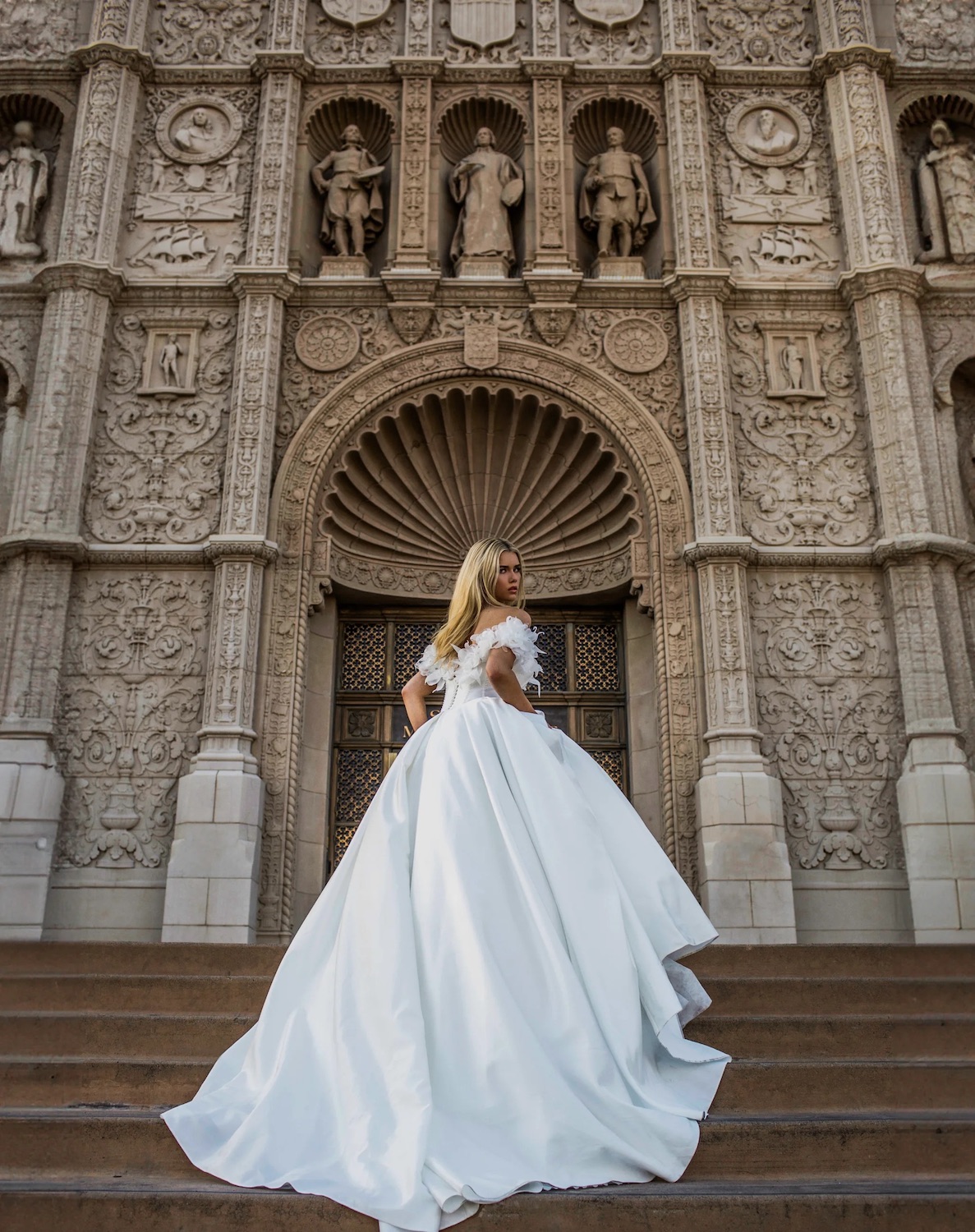 San Diego wedding dress shop and bridal salon Jana Ann Couture Bridal in Del Mar featuring a bride infront of Balboa Park's Museum of Man