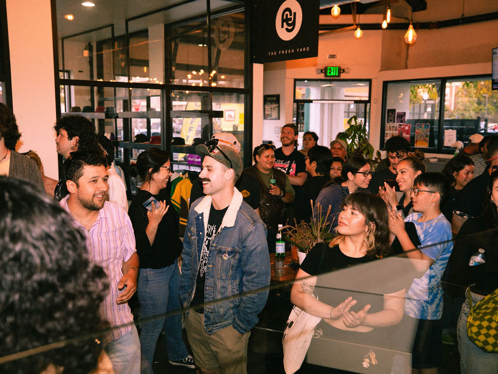 People wait in line outside the San Diego Market grocery store on 8th Street in National City, which is opening new restaurants and has a new owner