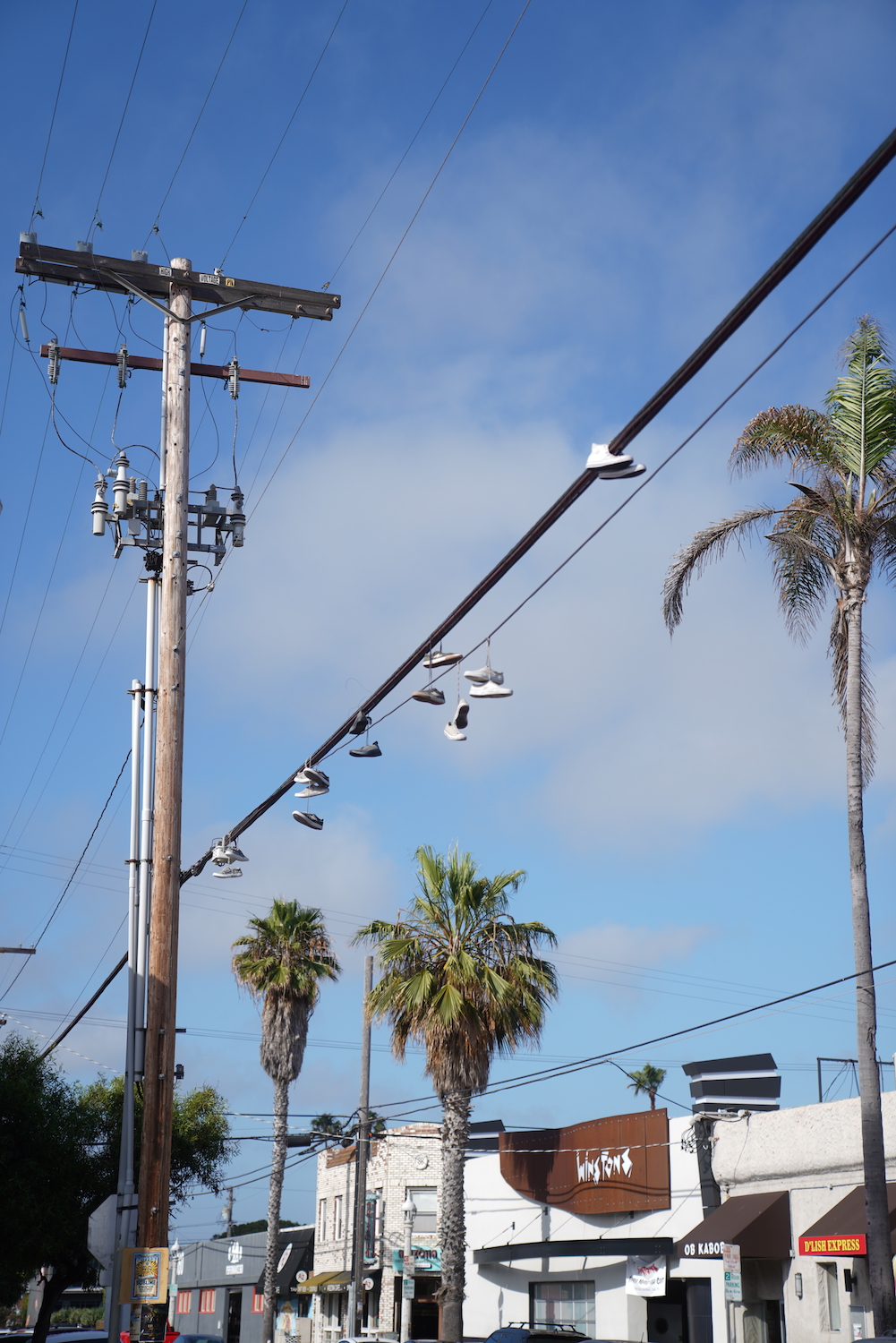 Shoes hanging on wires in an Ocean Beach, San Diego neighborhood