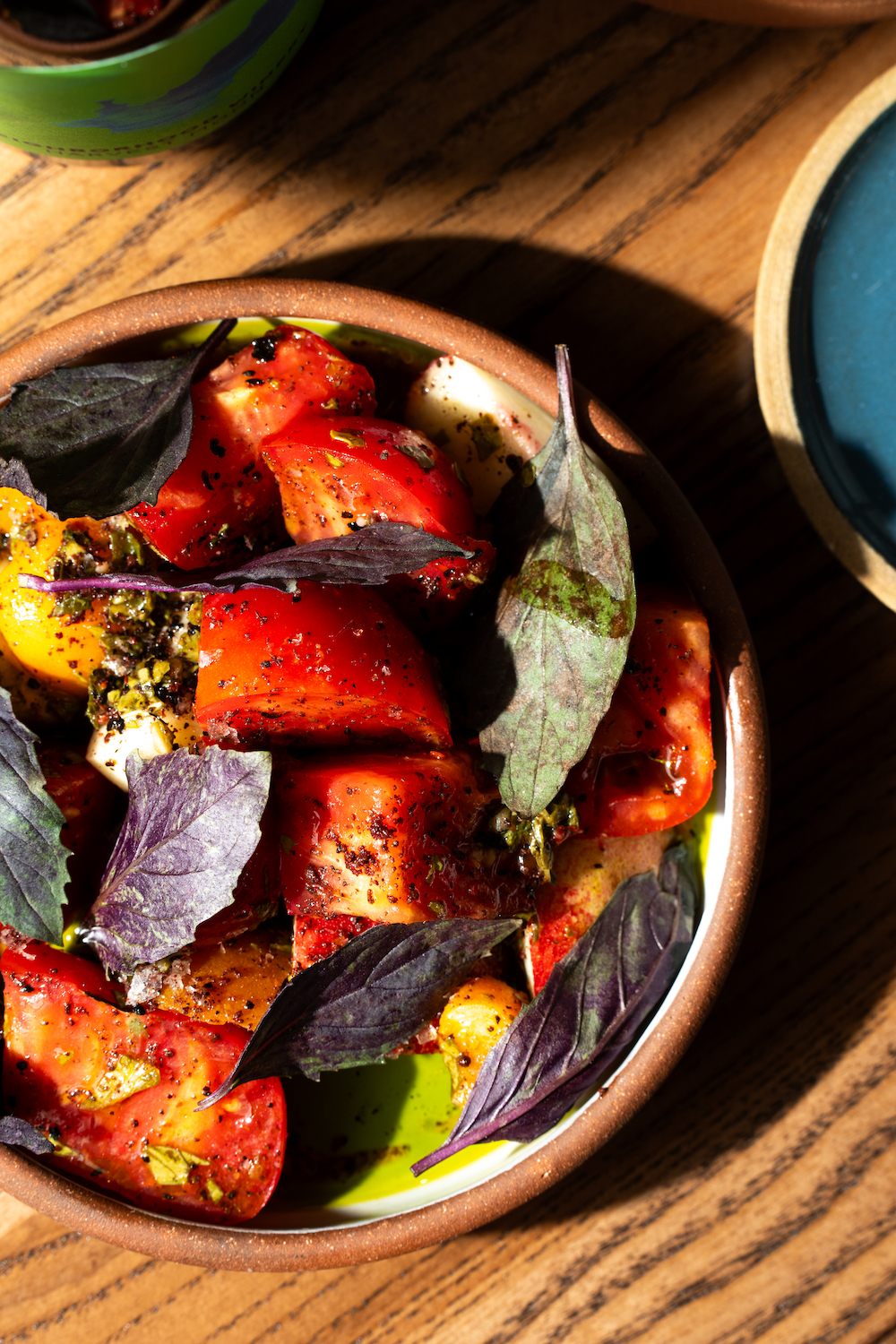 Roasted tomatoes on a plate from the farm-to-table restaurant Cellar Hand in Hillcrest in San Diego