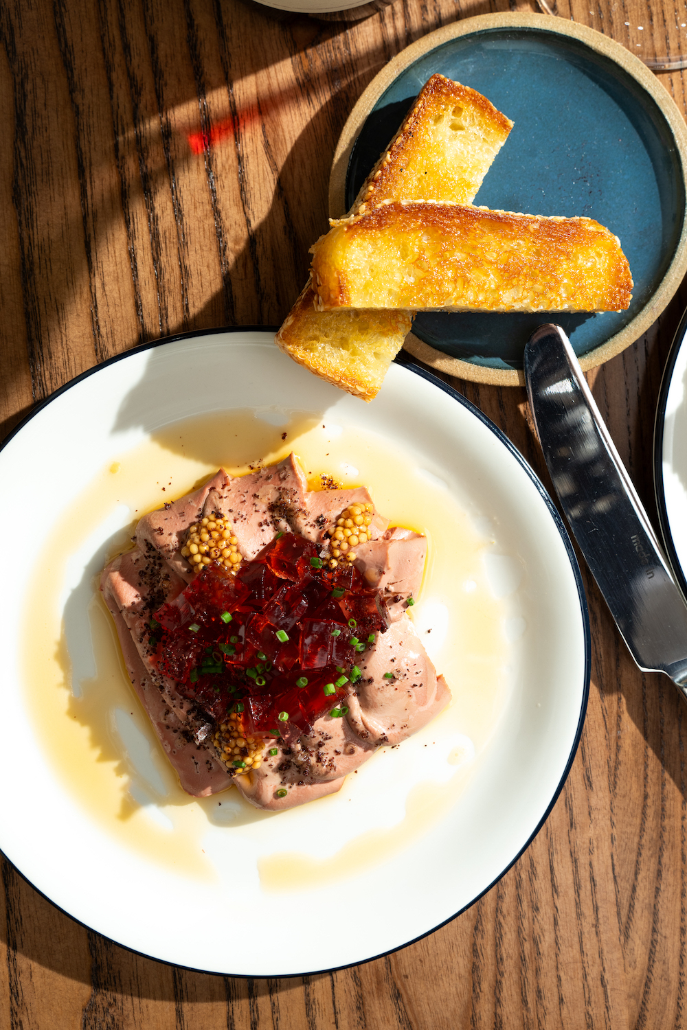 Chicken liver pate with orange wine Jell-O shots on brown butter toast from San Diego restaurant Cellar Hand in Hillcrest