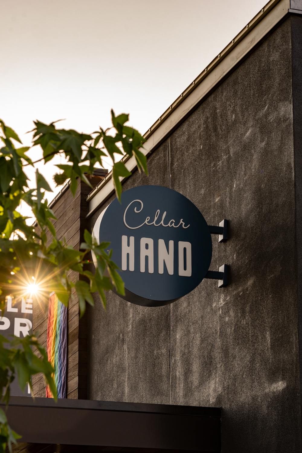 Exterior view of the San Diego restaurant Cellar Hand in Hillcrest with a sign