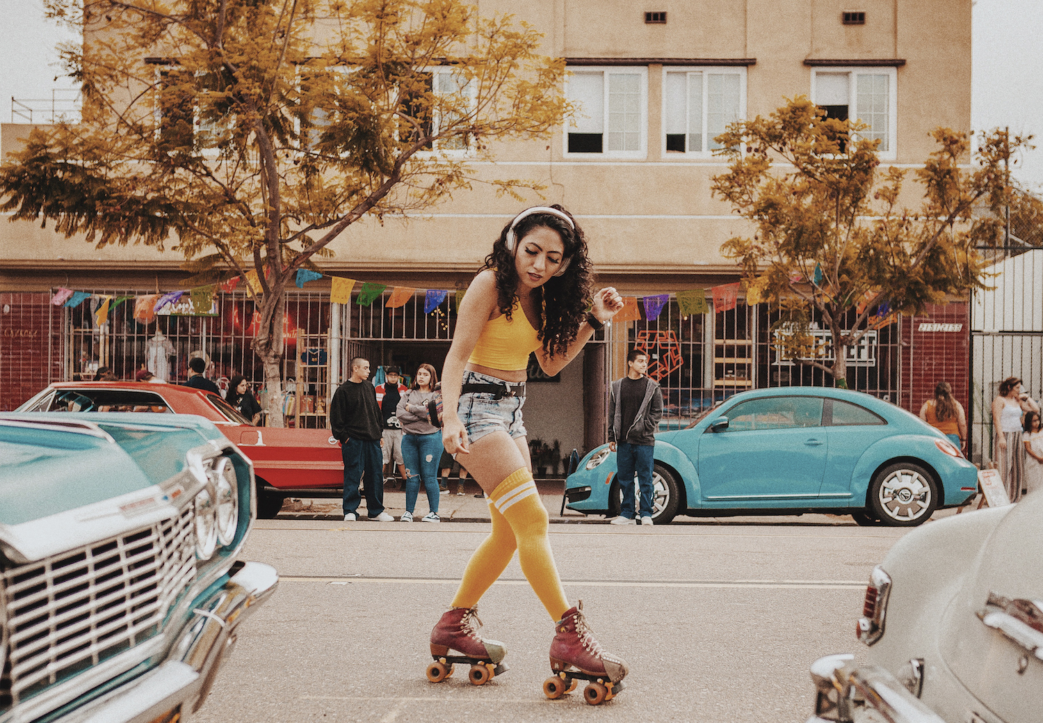 Things to do in Barrio Logan, San Diego featuring a woman rollerskating down Logan Avenue