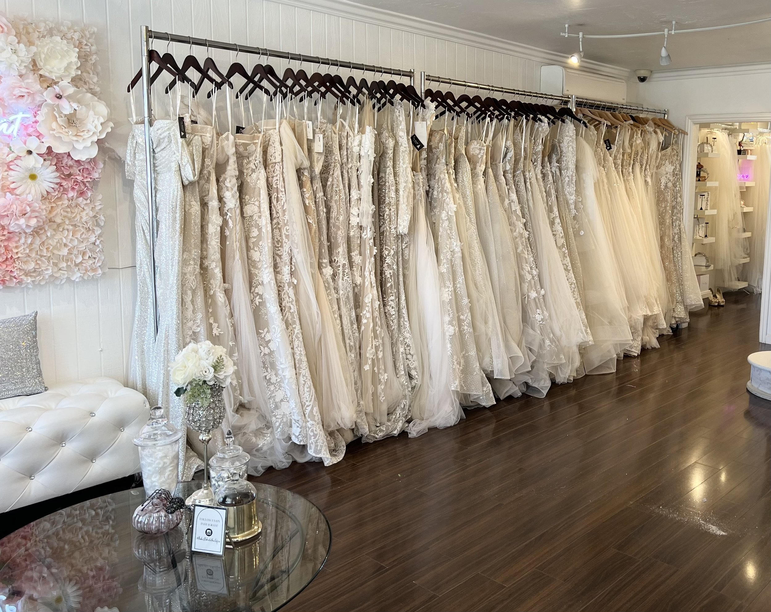 Interior view of The Busle bridal shop and salon in Del Mar in San Diego with a dress rack