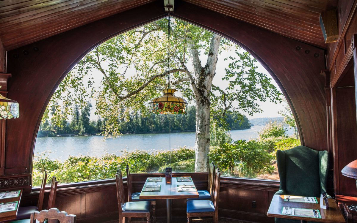 Interior of The Old Spaghetti Factory  in Portland, Oregon featuring a view of the river a popular restaurant for families traveling with kids