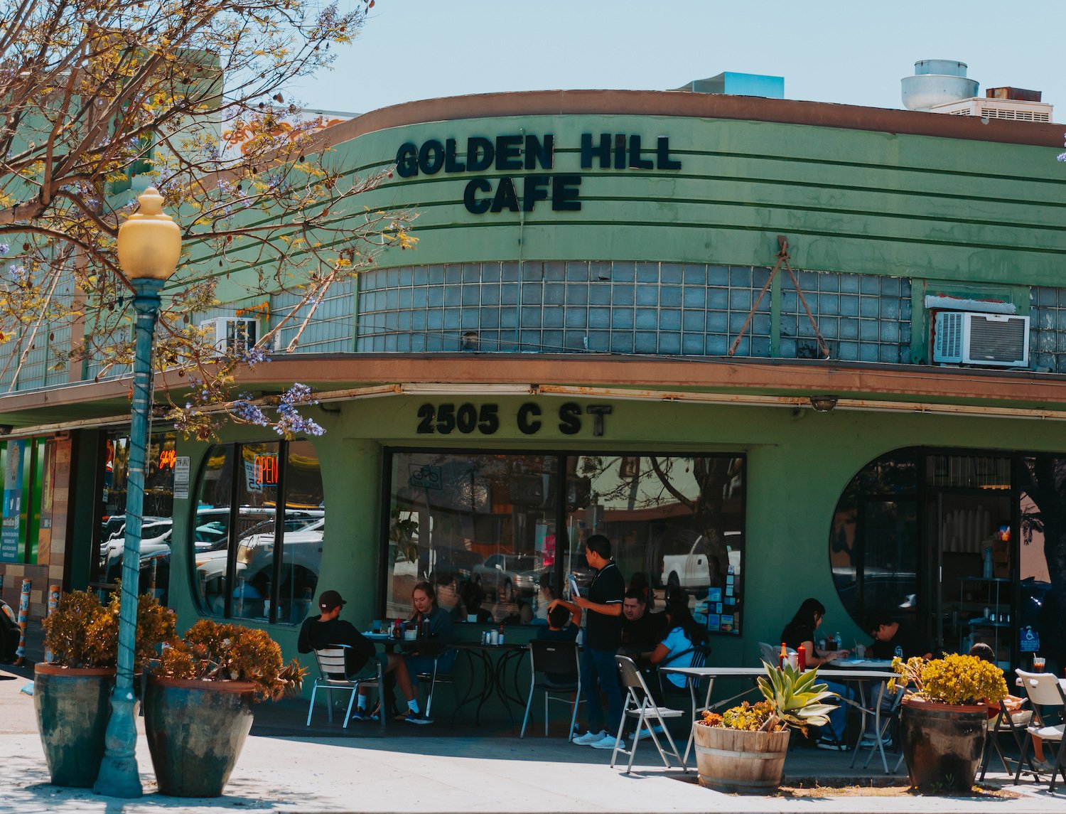 The exterior of San Diego restaurant Golden Hill Cafe on 25th street featuring outdoor dining tables