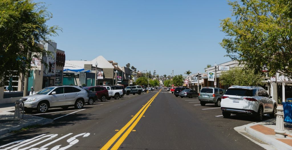 A San Diego street in La Mesa's downtown featuring shops, parking, and plenty of things to do