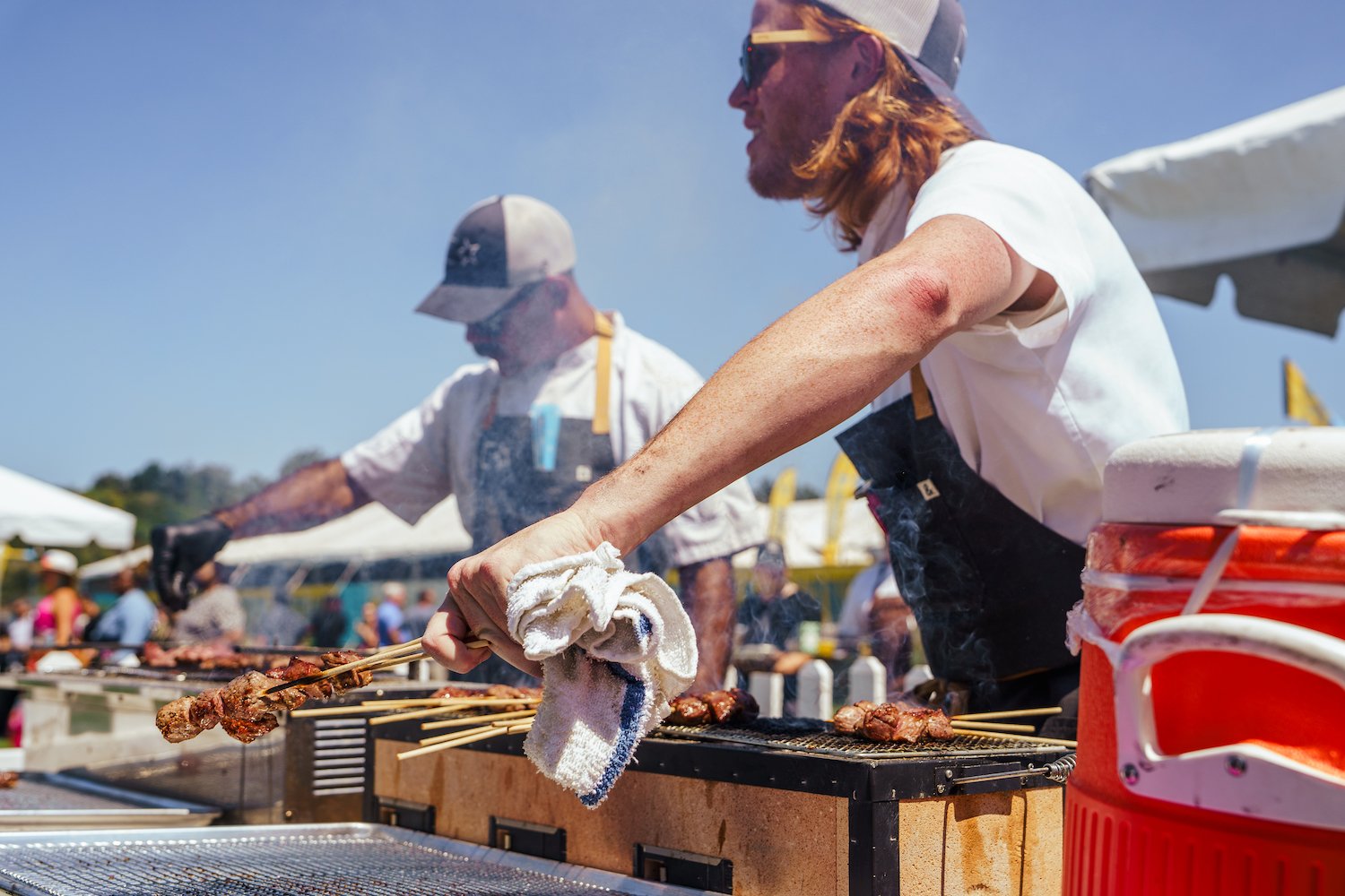 Del Mar Wine + Food Festival event on October 2-7, 2024 featuring chefs at the grand tasting event bbqing