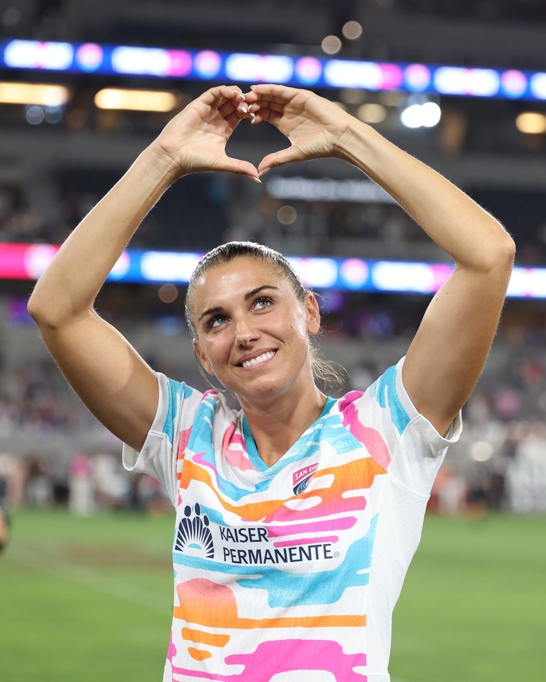 Alex Morgan making a heart symbol to fans during her final season with the San Diego Wave FC