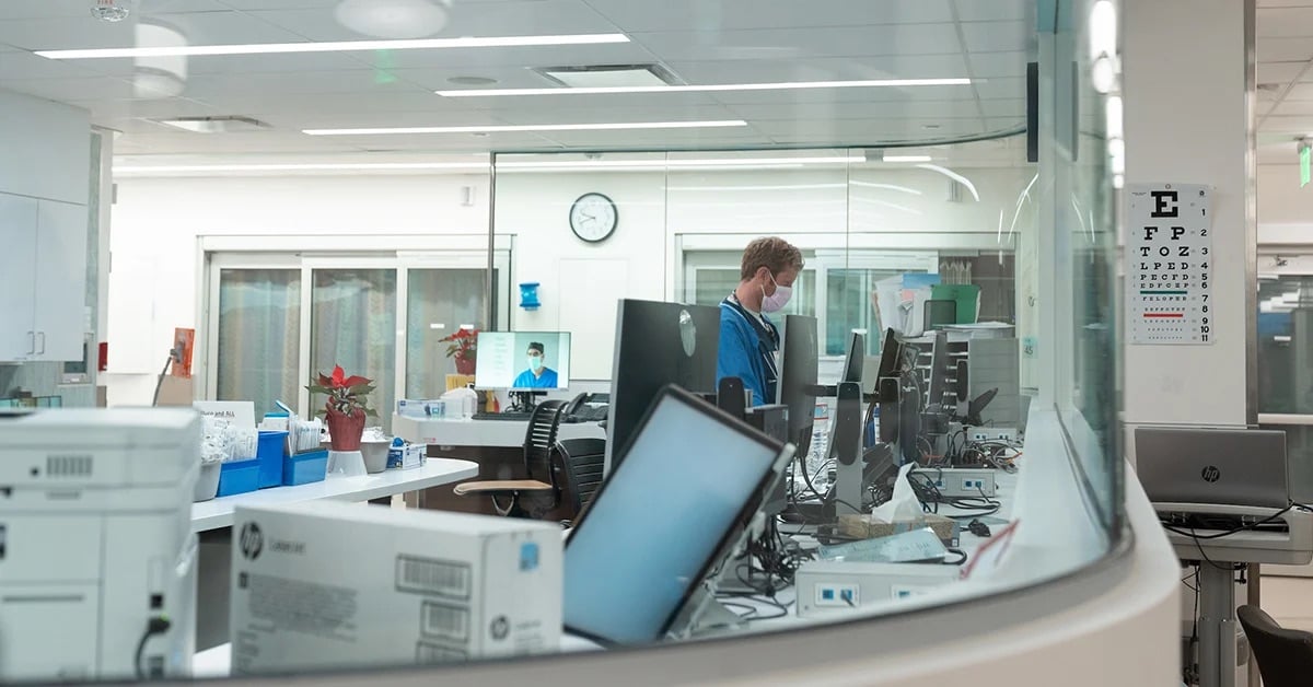 Interior of UC San Diego hospital center featuring doctors using computers with Artificial Intelligence models and functionality