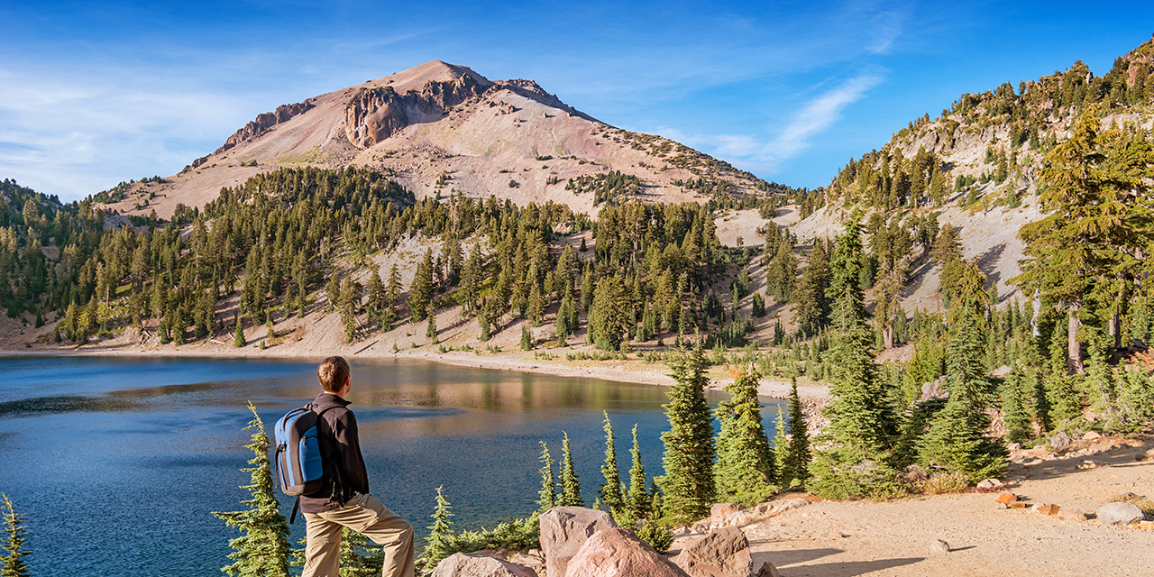 Guide to visiting California's national parks featuring Lassen Volcanic Park and a lake