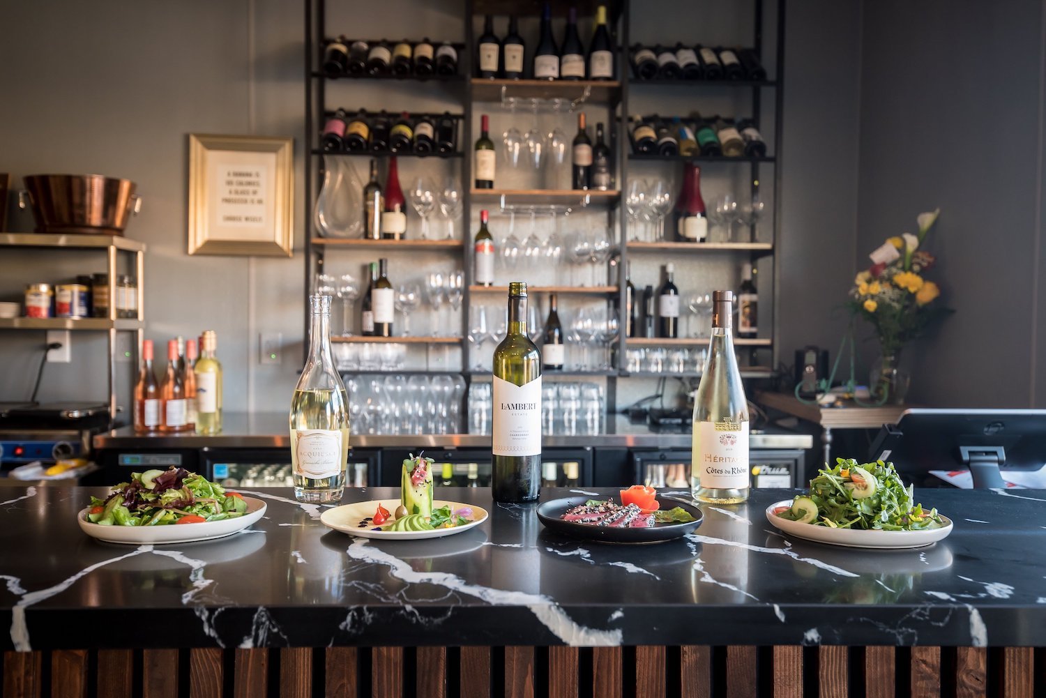 Best wine bars in San Diego featuring food and wine bottles from Zest Wine Bistro