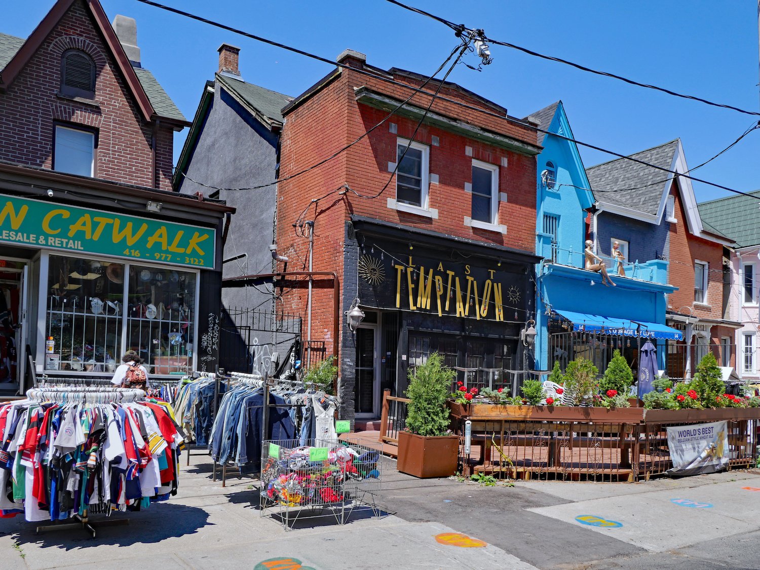  Kensington Market, Toronto is a downtown area where old Victorian houses have been converted into colorful shops selling vintage clothing and exotic foods.