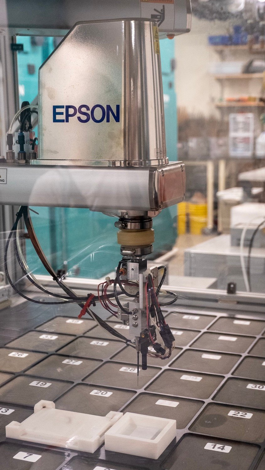 An epson seed-planting robot assisting the Salk Institute lab's Harnessing Plants Iniative 