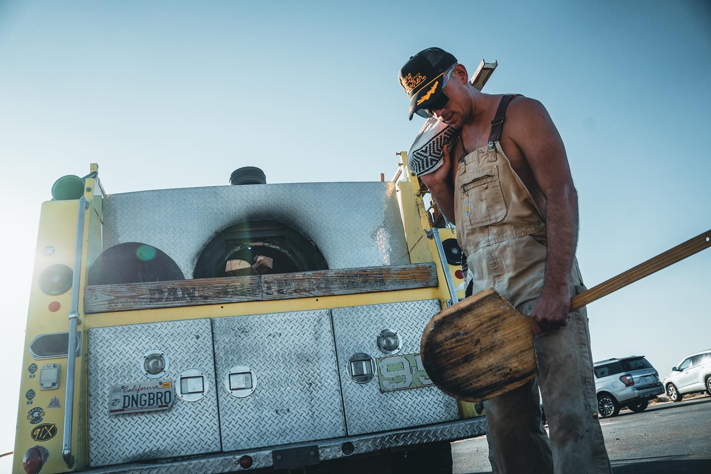 San Diego veteran-owned food truck Dang Brother Pizza featuring a chef next to a retro fire truck