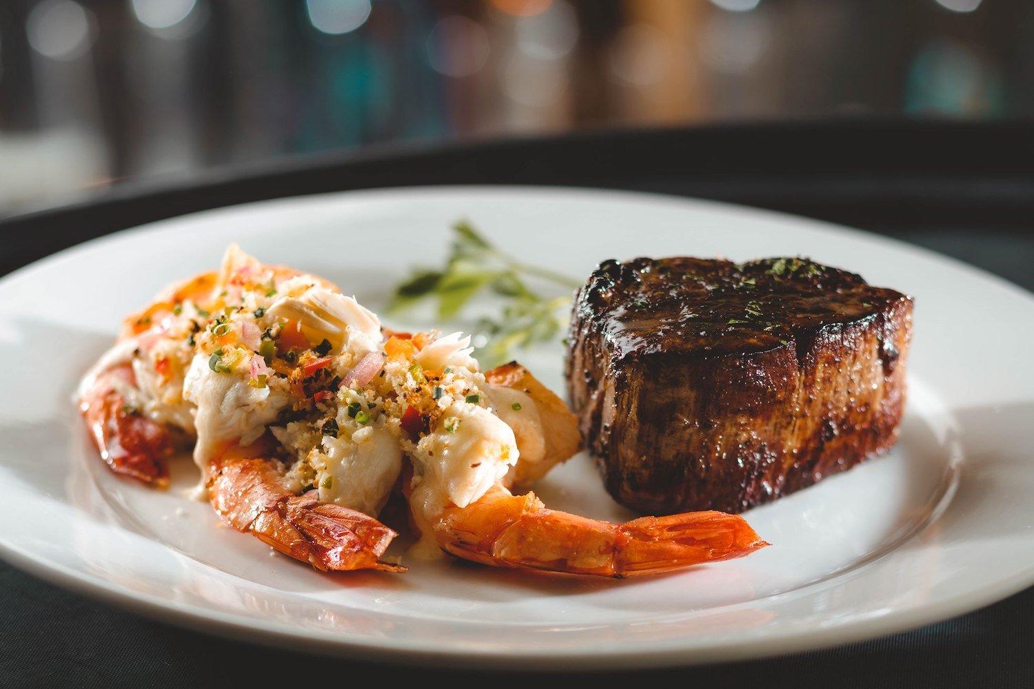 Best San Diego steak restaurants featuring a filet mignon and shrimp from Eddie V's Prime Seafood in La Jolla