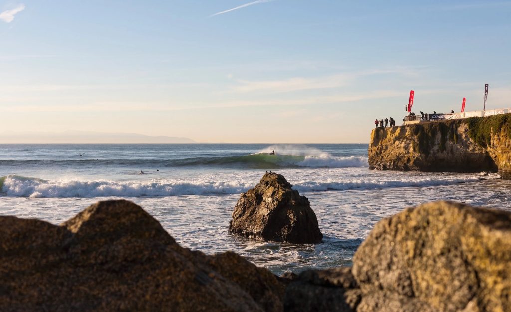 Best California surf spots featuring a surfer at Steamer Lane in Santa Cruz