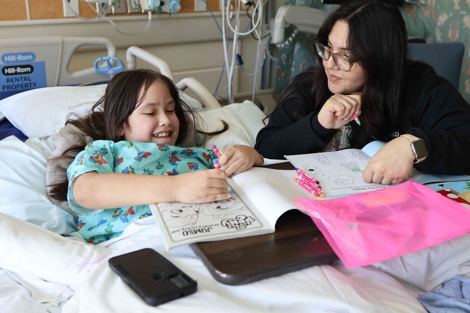 Interior of Rady Children's Hospital in San Diego featuring a nurse playing with a patient 