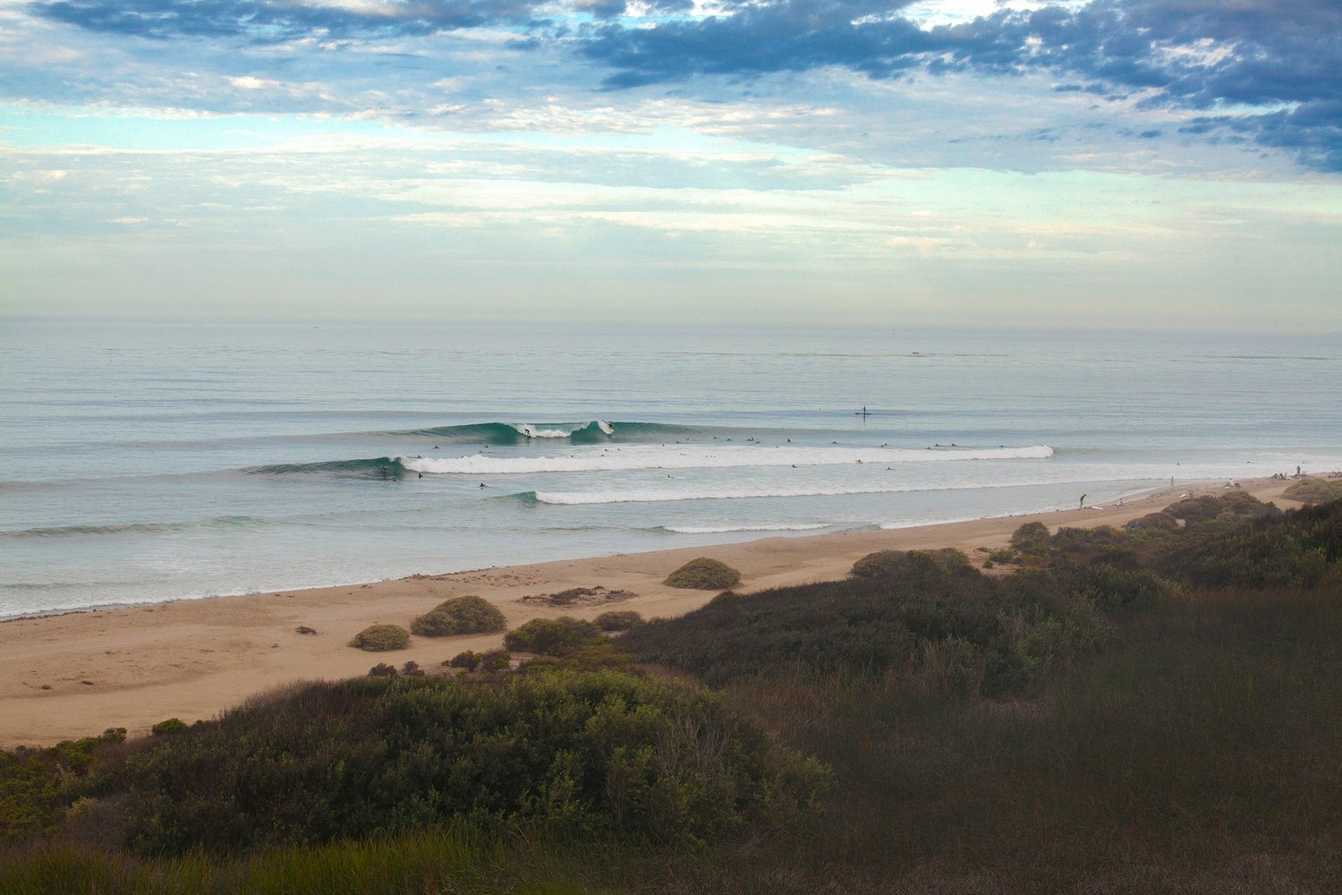 Best California surf spots featuring surfers at Lower's Trestles in San Onofre