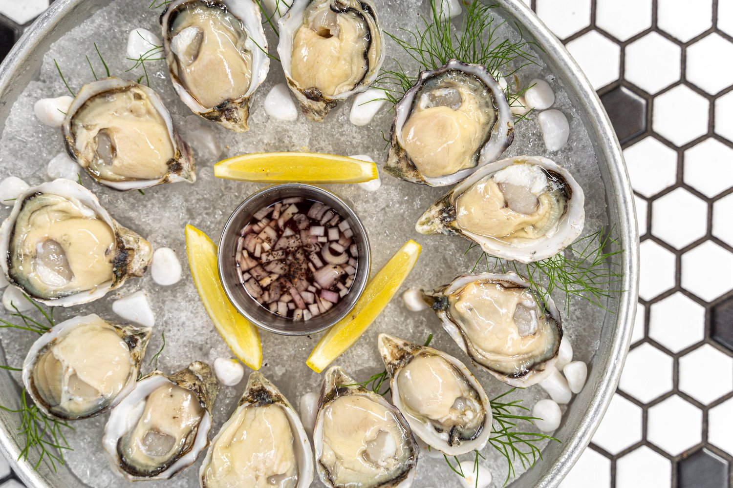 New San Diego restaurant Vále Bodega opening in Solana Beach from the team behind Valentina featuring a plate of oysters