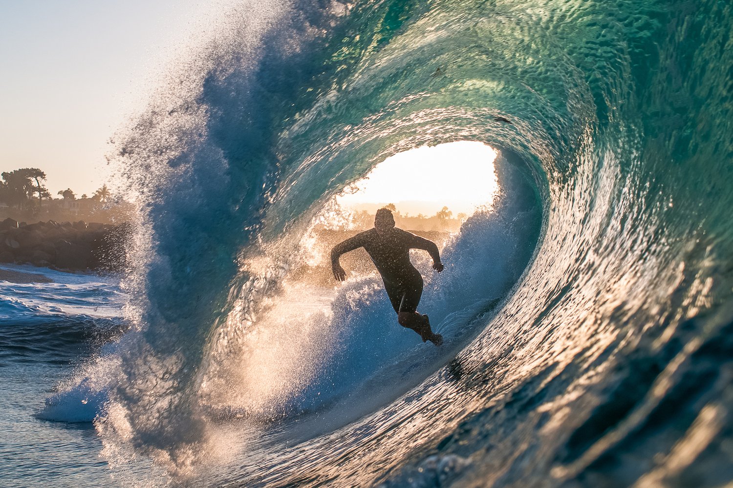 Best California surf spots featuring a surfer wiping out at The Wedge in Orange County