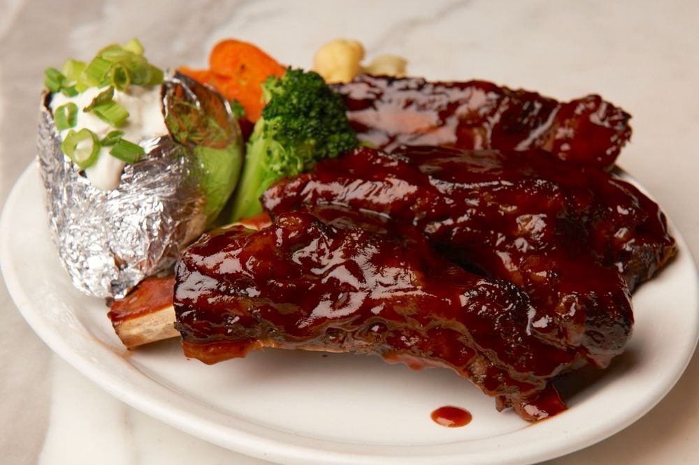 Ribs, a baked potato, and veggies from Cafe La Maze in National City