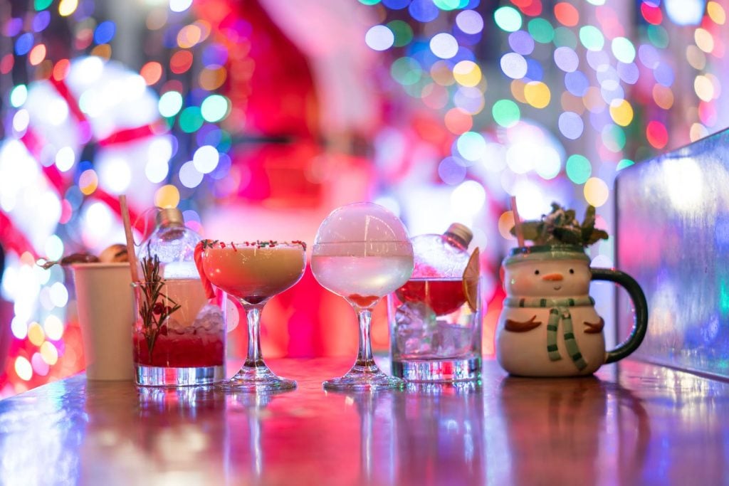 Holiday date ideas in San Diego featuring holiday pop-up bar Holly Jolly Bar at Las Tres Catrinas