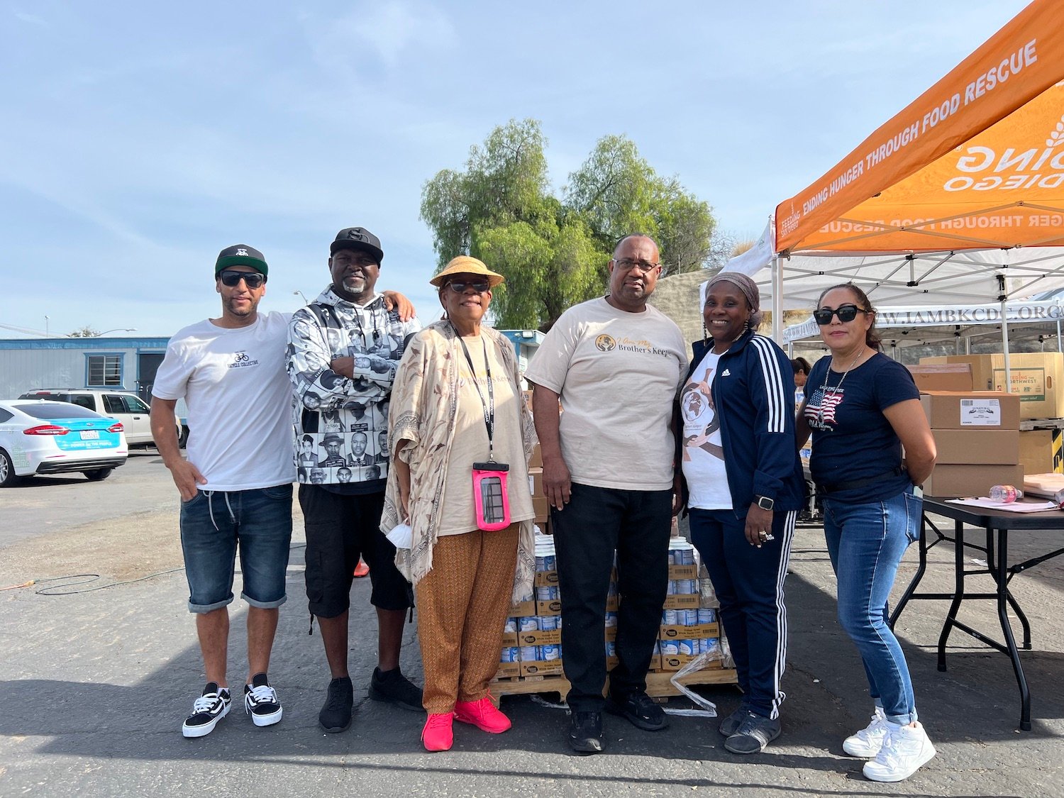 San Diego nonprofits I Am My Brother’s Keeper and the San Diego Bicycle Collective distributing food and bikes in Encanto 