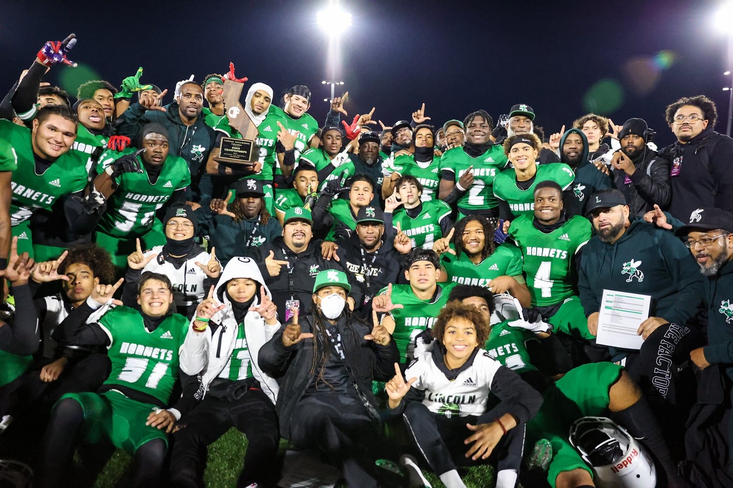 Lincoln High School's football team celebrating their second state championship in 2024 in a span of three years